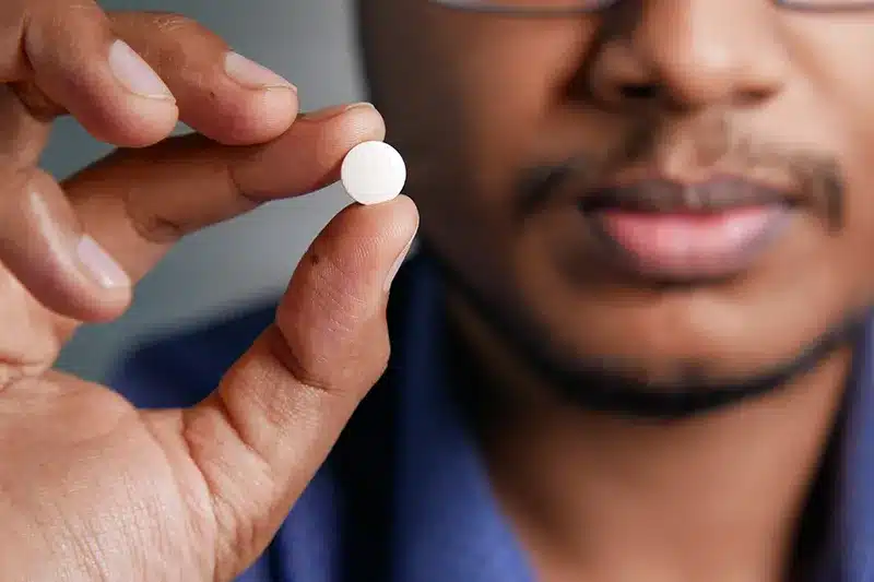 Man Holding Pill 178545694 L 800 Man Holding Pill 178545694 L 800